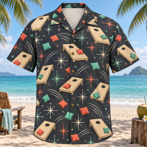 Front view of Atomic Motion Cornhole Hawaiian Shirt with original atomic starbursts and curved motion paths around plain wooden cornhole boards with circular holes, colorful fabric bean bags and toss arcs