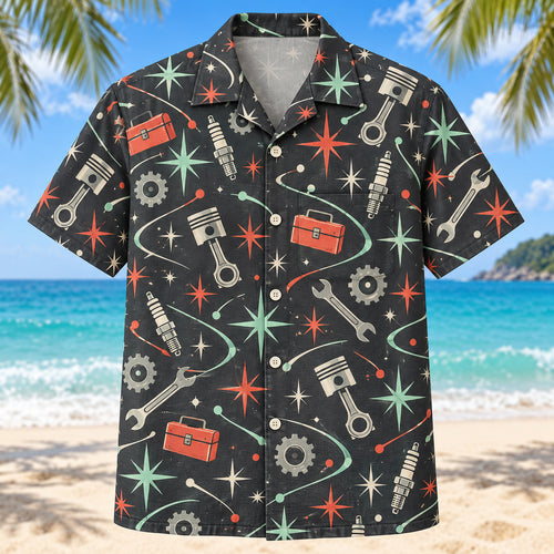 Front view of Atomic Motion Mechanic Hawaiian Shirt with original atomic starbursts and curved motion paths around generic pistons, spark plugs, wrenches, toolboxes and gears