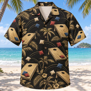 Front view of Black Gold Cornhole Hawaiian Shirt with elegant antique-gold plain wooden cornhole boards with circular holes, colorful fabric bean bags and toss arcs with fine line geometry