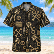 Front view of Black Gold Mechanic Hawaiian Shirt with elegant antique-gold generic pistons, spark plugs, wrenches, toolboxes and gears with fine line geometry