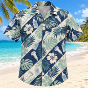 Front view of Gel And Garden Navy Cream Diagnostic Medical Sonographer Hawaiian Shirt with original blank gel bottles, generic probes and broad tropical leaves in alternating diagonal bands