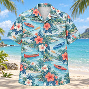 Front view of Hibiscus Kayak and Canoe Hawaiian Shirt with original hibiscus blooms framing plain kayaks, canoes, paddles, river bends and bankside plants