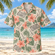 Front view of Instrument Garden Coral Sage Surgical Technologist Hawaiian Shirt with original generic closed clamps, scissors and instrument trays among tropical leaves