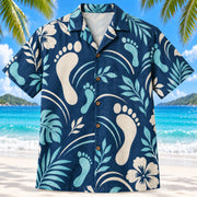 Front view of Motion Steps Navy Physical Therapist Hawaiian Shirt on a Hawaiian beach with fine white sand