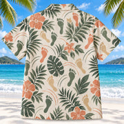 Back view of Motion Steps Sage Physical Therapist Hawaiian Shirt on a Hawaiian beach with fine white sand