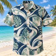 Front view of Movement Coast Navy Cream Athletic Trainer Hawaiian Shirt with original abstract movement arcs, generic tape and tropical leaves without team marks