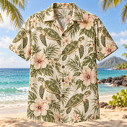 Front view of Olive Ridley Bloom Sea Turtle Hawaiian Shirt with olive ridley sea turtles with soft tropical blooms