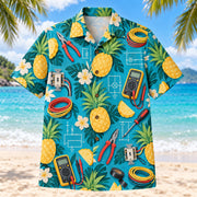 Front view of Pineapple Pop Electrician Hawaiian Shirt with original cut-paper pineapples alongside accurate pliers, wire, multimeters and original electrical diagrams in a roomy repeat