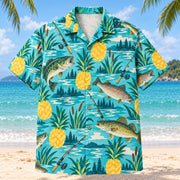 Front view of Pineapple Pop Freshwater Fishing Hawaiian Shirt with original cut-paper pineapples alongside original bass, trout and walleye illustrations, plain rods, lake ripples and reeds in a roomy repeat