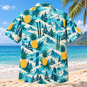 Back view of Pineapple Pop Ski and Snowboard Hawaiian Shirt with matching ski and snowboard artwork in turquoise, pineapple yellow, deep teal, cream