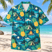 Front view of Pineapple Pop Tent Camping Hawaiian Shirt with original cut-paper pineapples alongside generic tents, camp lanterns, campfires, chairs and woodland night skies in a roomy repeat