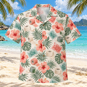 Front view of Tape Garden Coral Sage Athletic Trainer Hawaiian Shirt with original unbranded athletic tape rolls, cold packs and hibiscus in an airy repeat